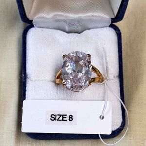 ¾ INCH GENUINE CRYSTAL RING, by SHAY LOWE, SIZE 8, CLEAR COLOUR, GOLD TONE, OVAL